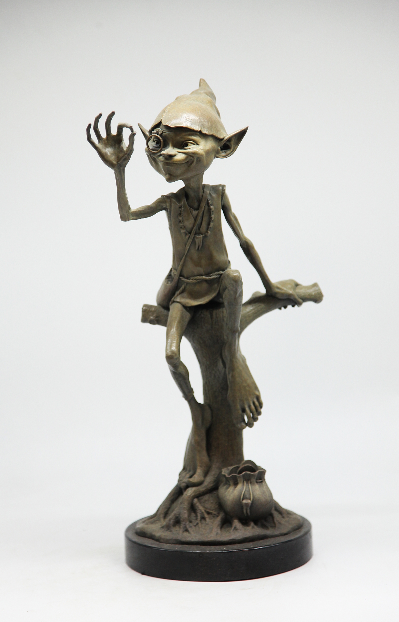 Adorable Bronze Figurative Goblin Sculpture depicting The Tooth Fairy, Inspecting a Tooth, his bag of coins by his side