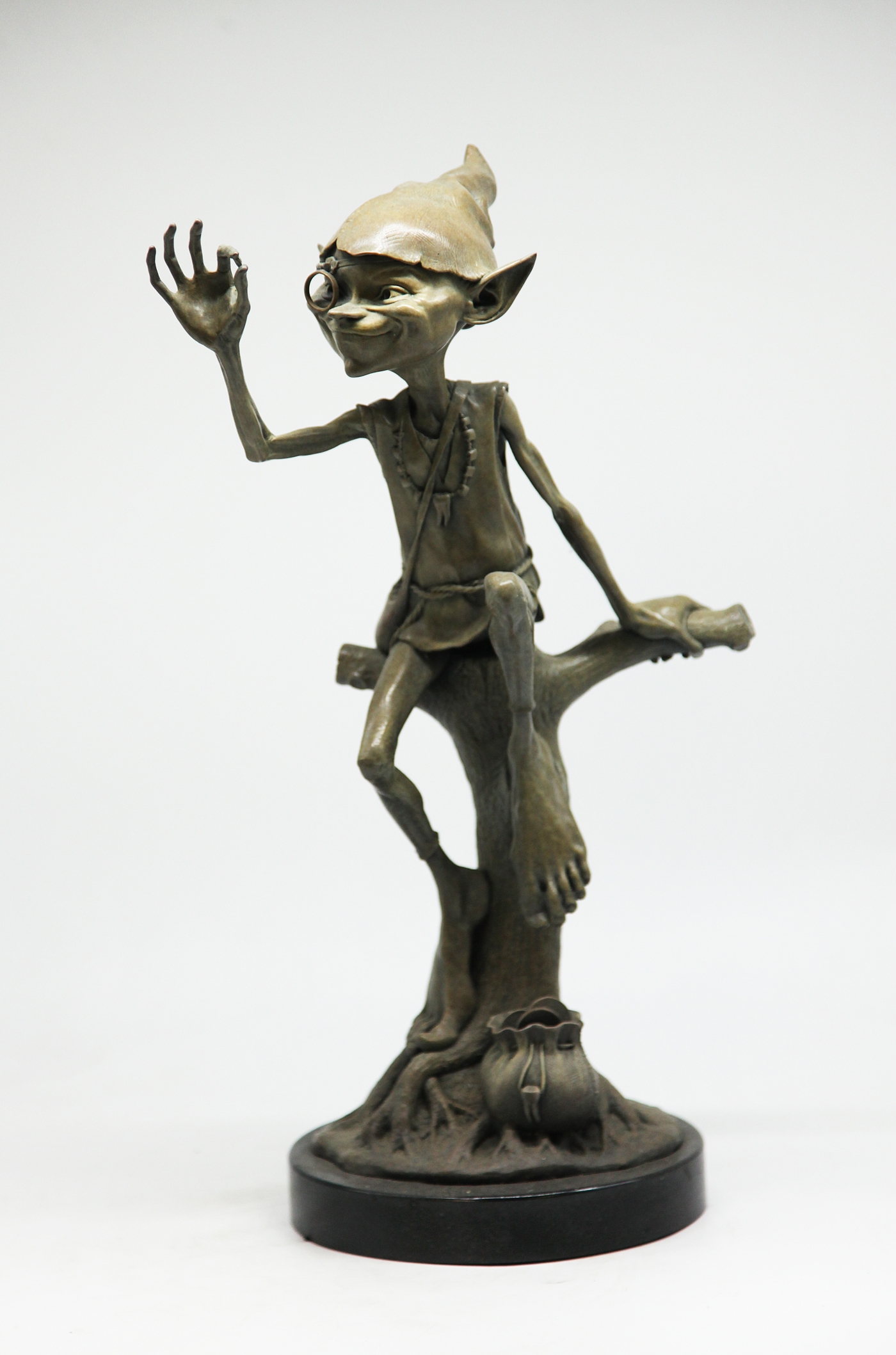 Adorable Bronze Figurative Goblin Sculpture depicting The Tooth Fairy, Inspecting a Tooth, his bag of coins by his side