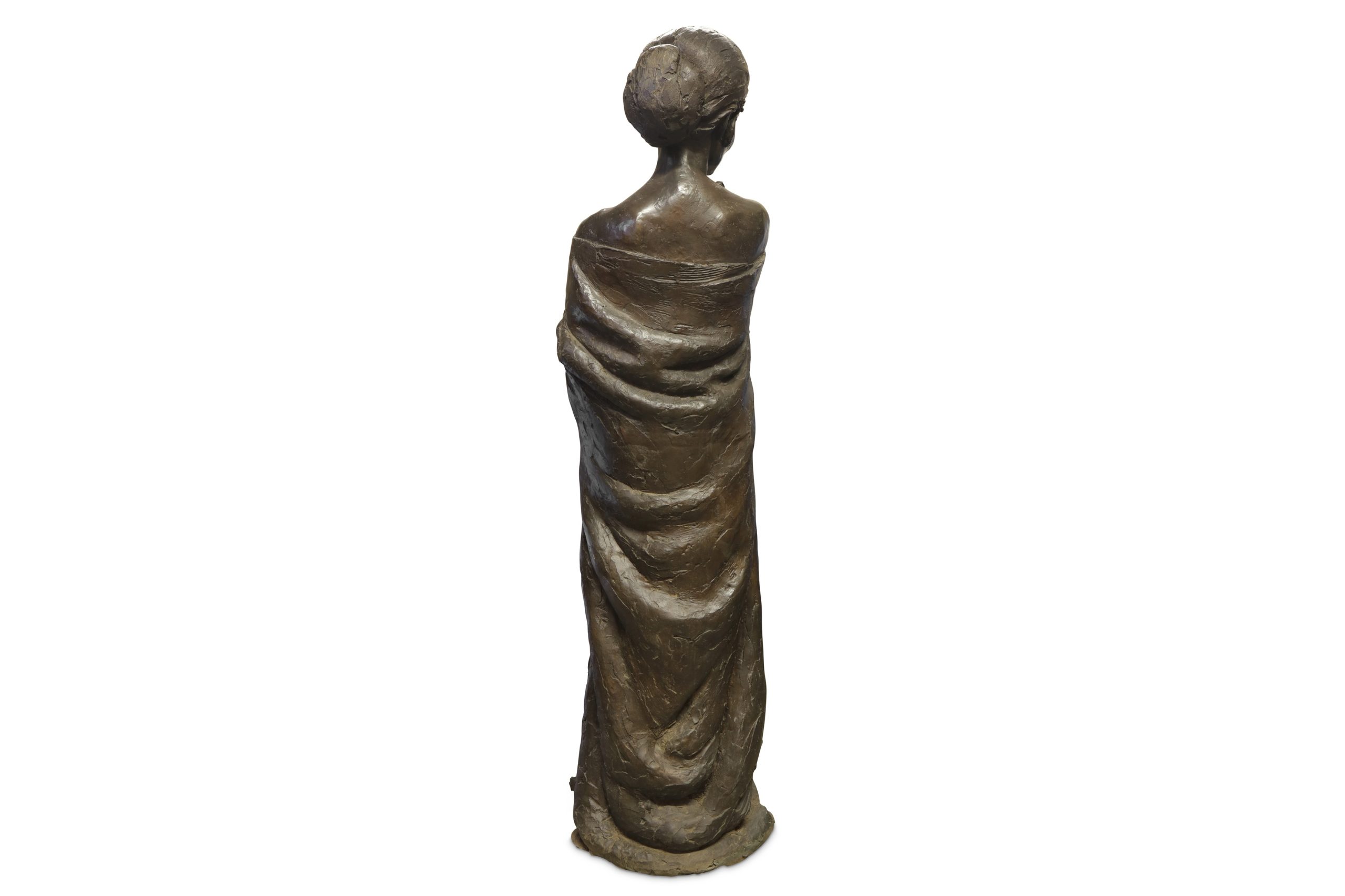 A bronze with black patina sculpture of a woman smiling and wearing a cloak.