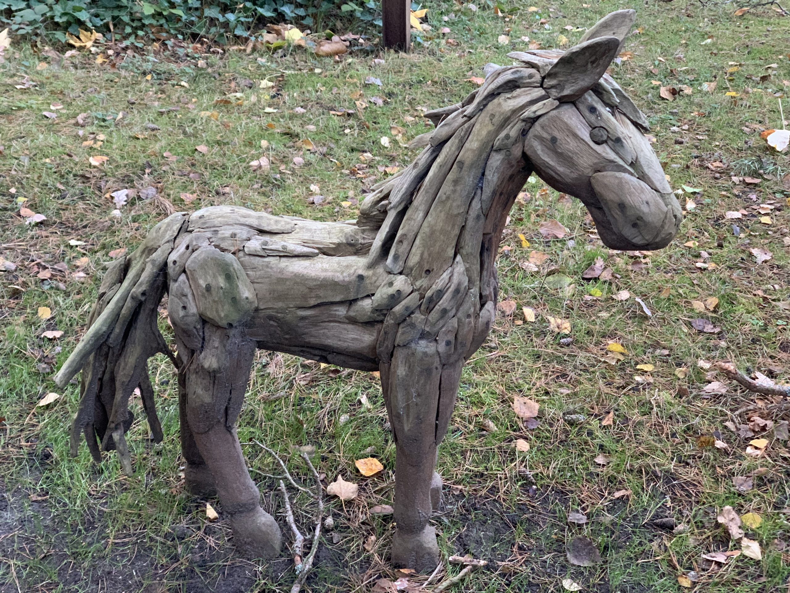 A driftwood sculpture of a small foal.