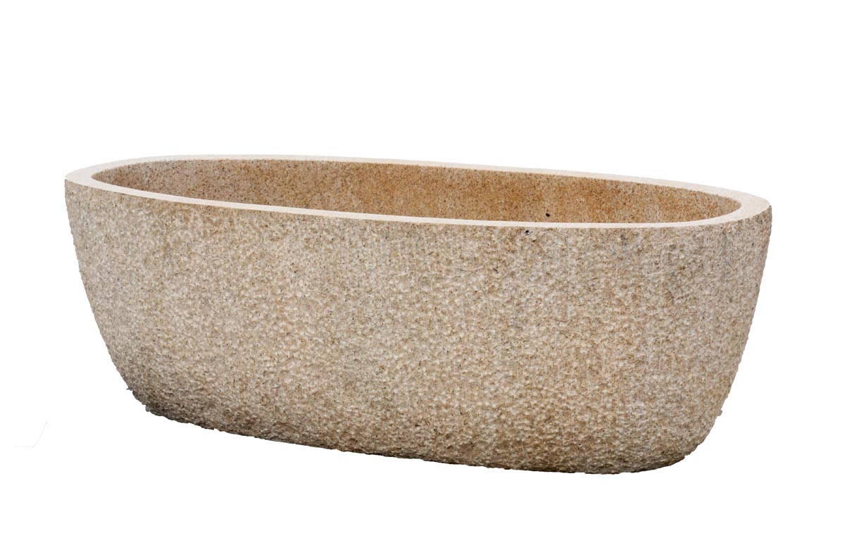 A modern stone sculpture of a large brown and deep trough.