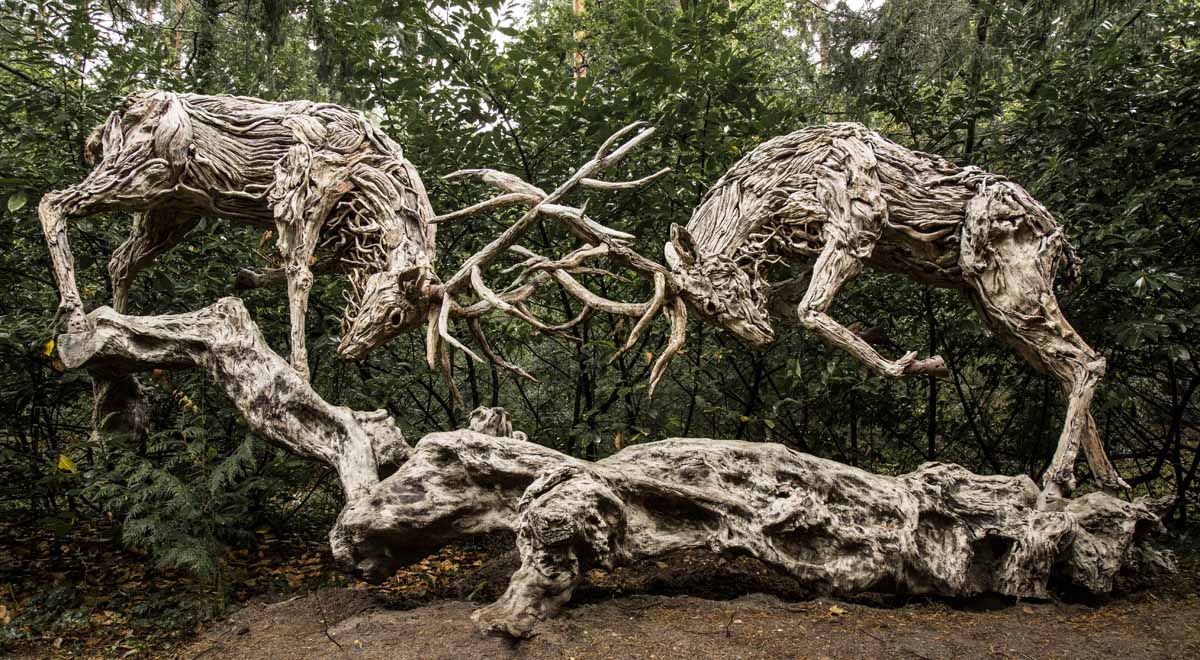 Rutting Stags by James Doran-Webb is a natural steel and wood sculpture of a pair of stags fighting each other.