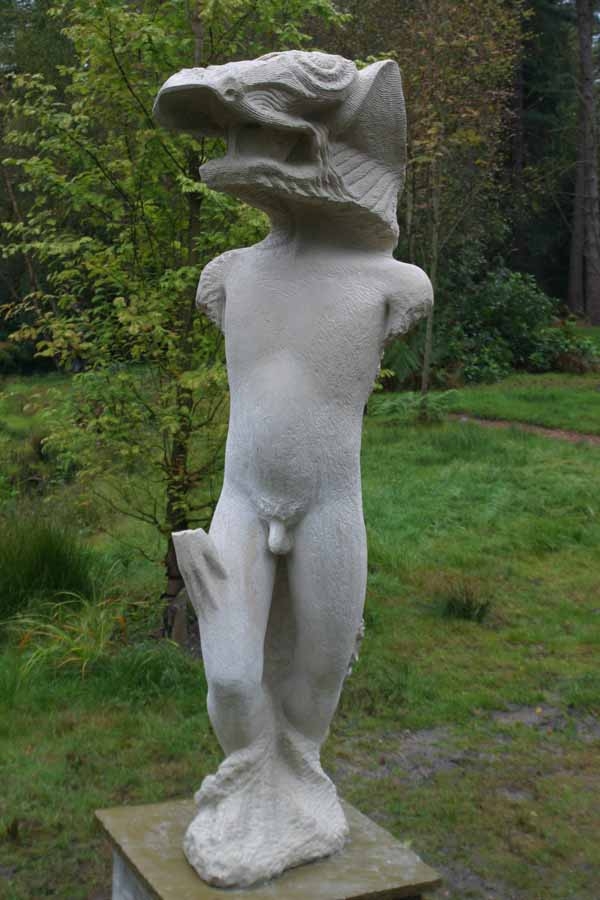 A figurative portland stone sculpture of a man standing while wearing a animals head.
