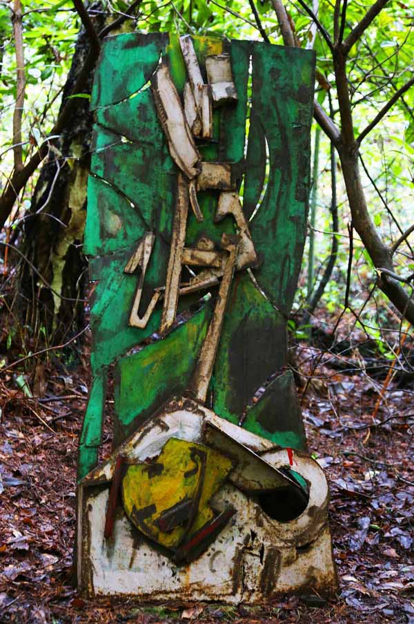 A abstract steel sculpture of a variety of metal pieces forming a scene.