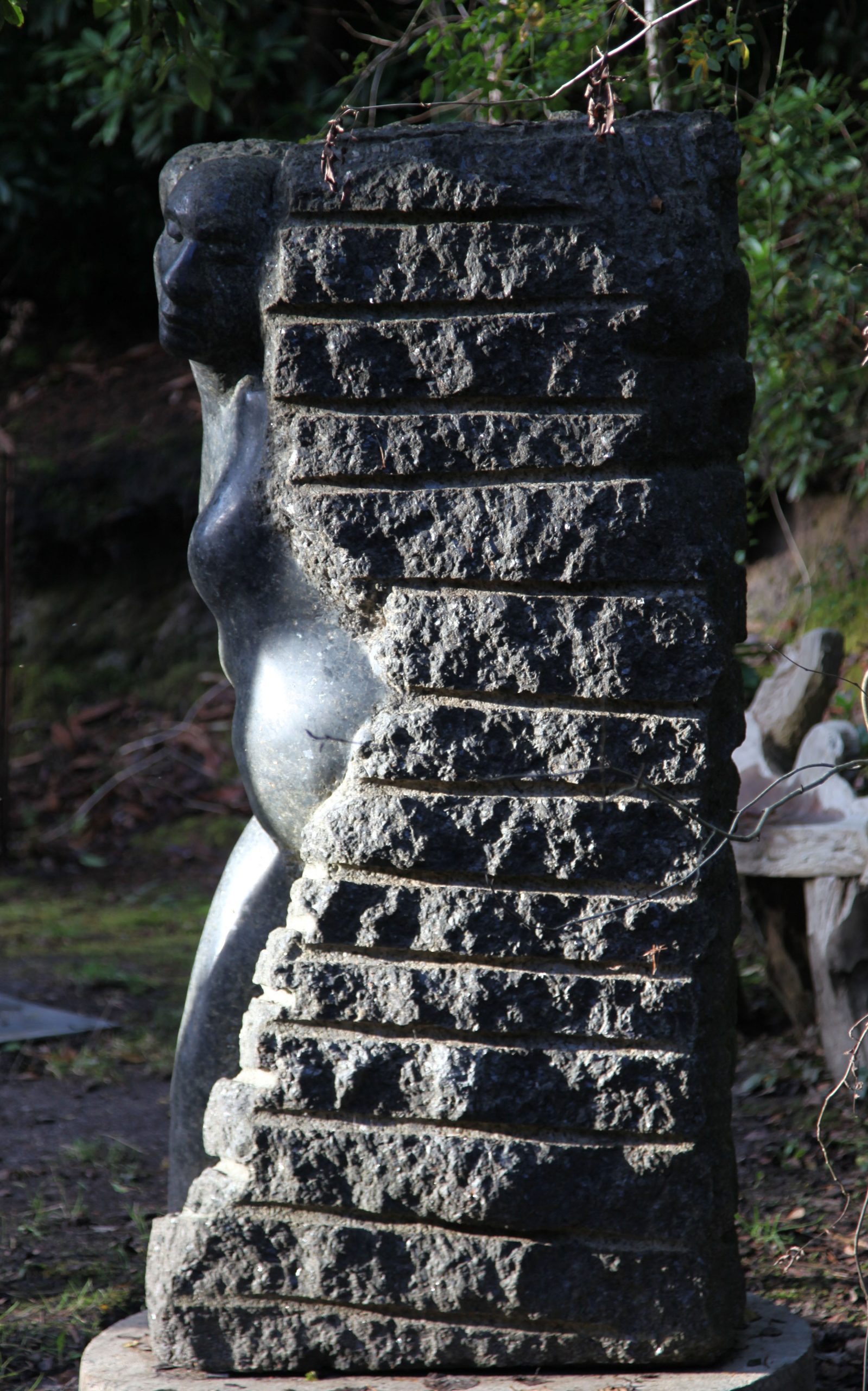 Large Stone Outdoor Sculpture of a Figure Emerging from Stone