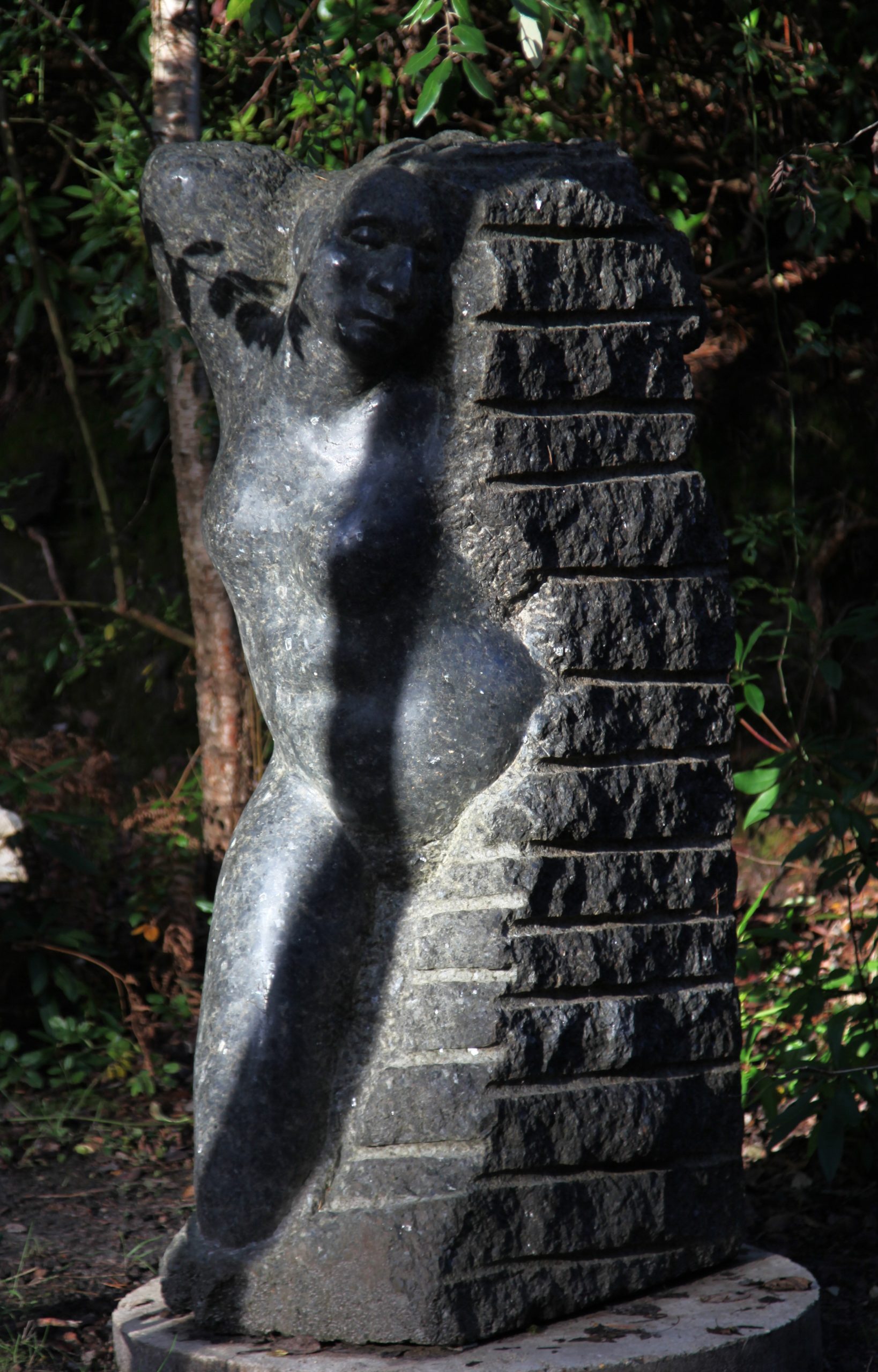 Large Stone Outdoor Sculpture of a Figure Emerging from Stone