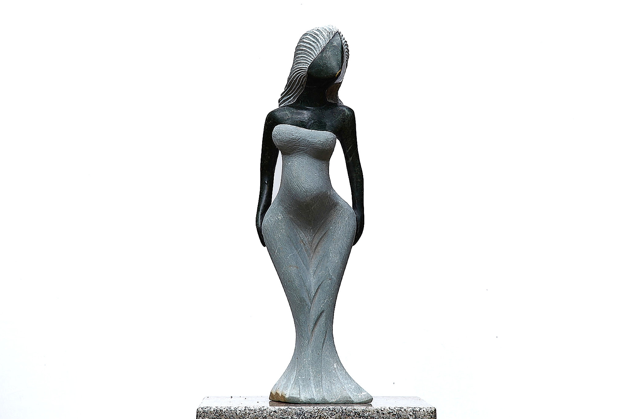 A Shona sculpture made of Opal stone of a woman in a dress.