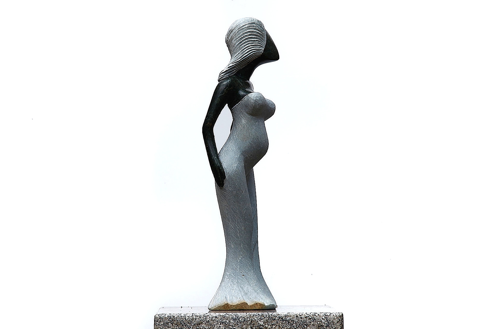 A Shona sculpture made of Opal stone of a woman in a dress.