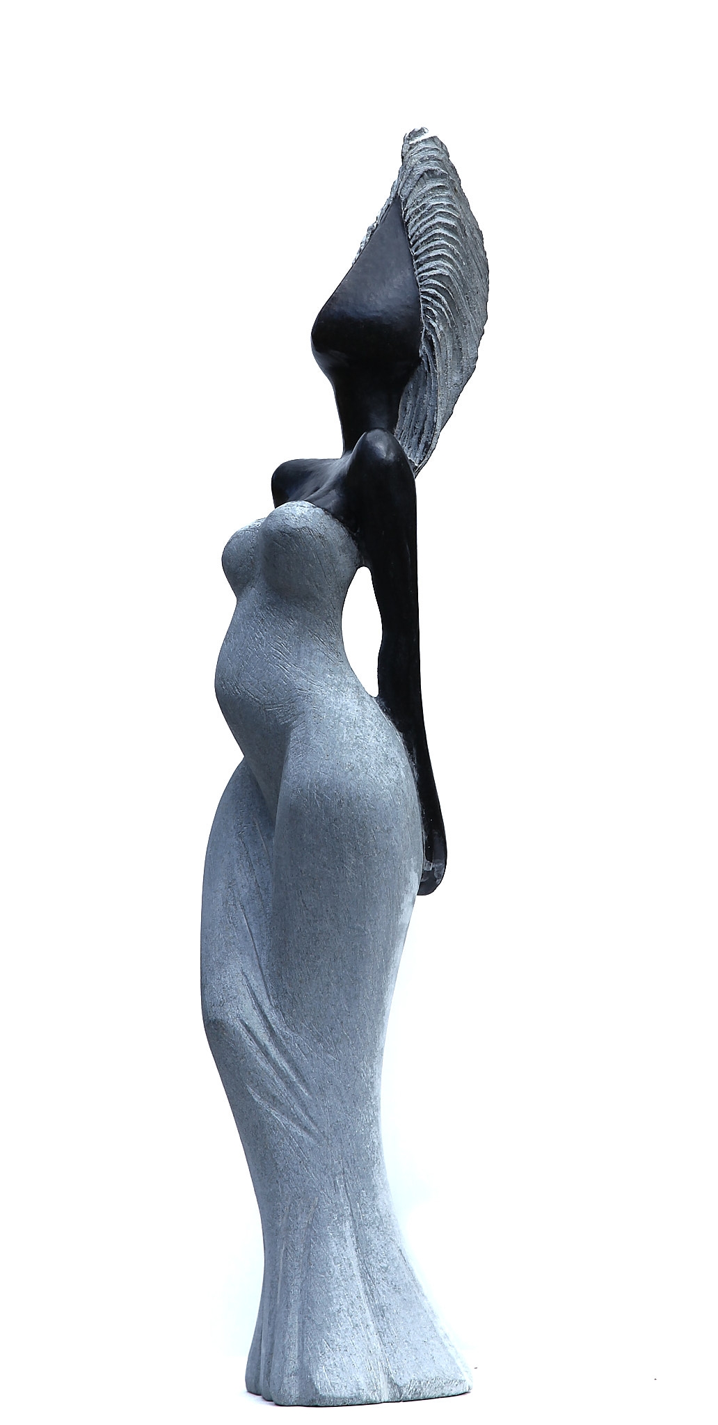 A Shona sculpture made of Opal stone, showcasing a woman in a dress.