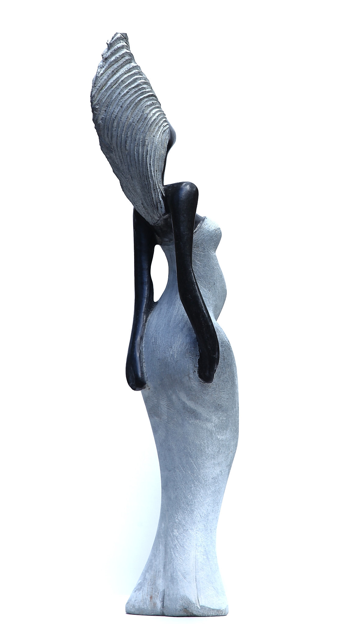 A Shona sculpture made of Opal stone, showcasing a woman in a dress.