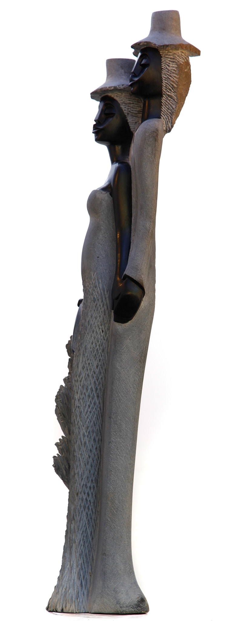 A figurative Shona sculpture of a man and a woman stood with each other.