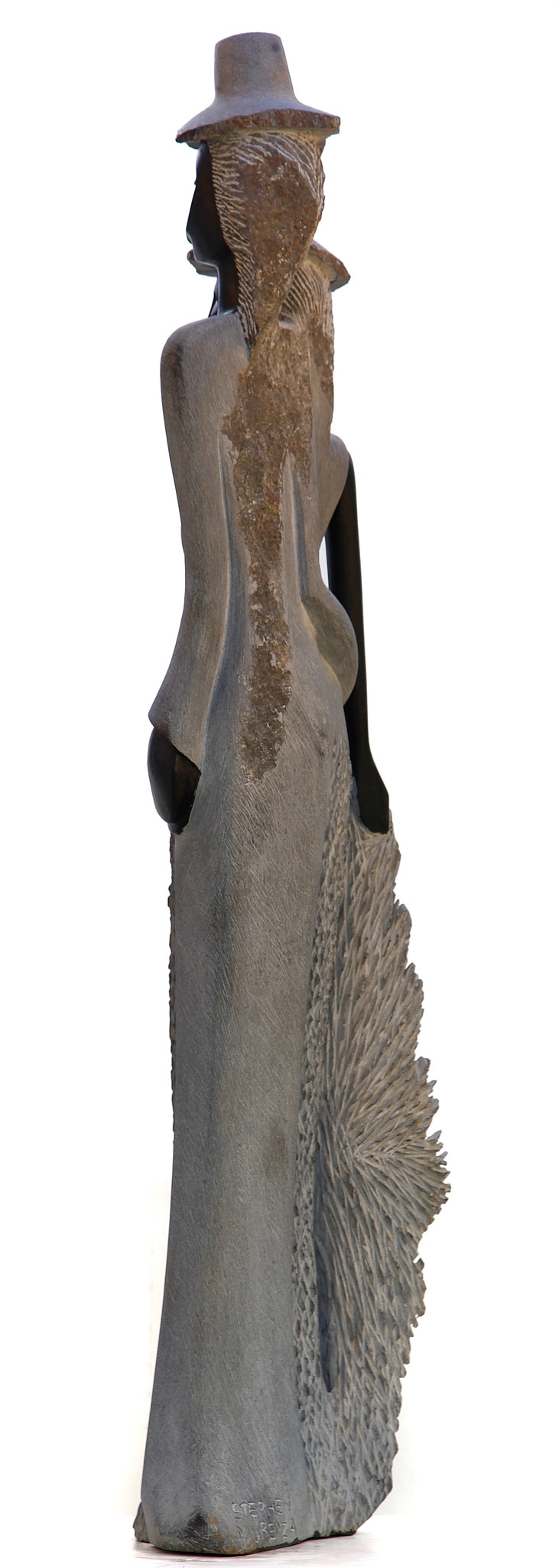 A figurative Shona sculpture of a man and a woman stood with each other.