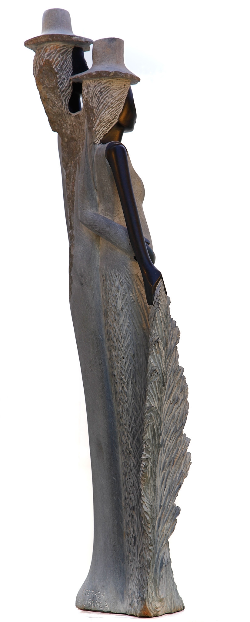 A figurative Shona sculpture of a man and a woman stood with each other.