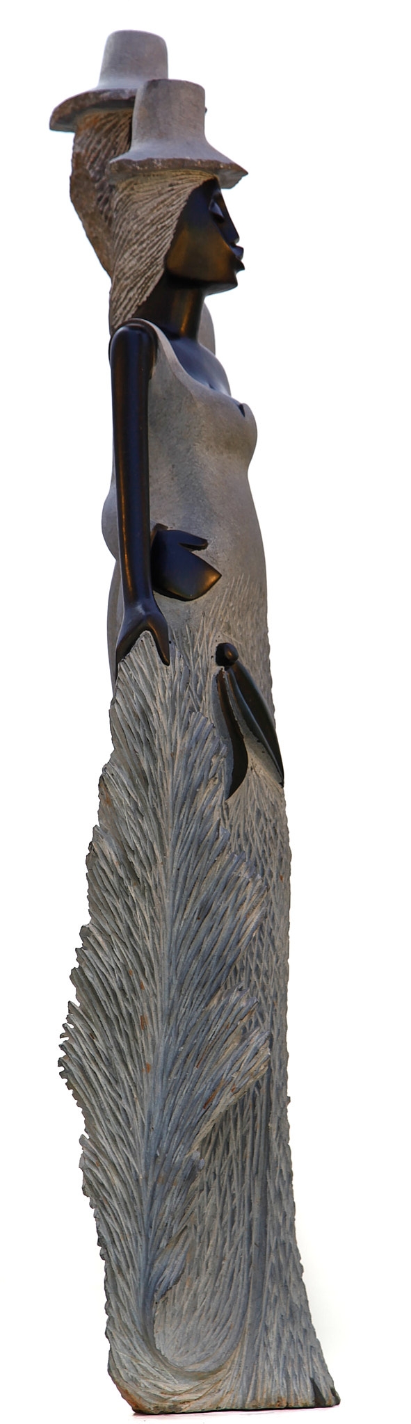 A figurative Shona sculpture of a man and a woman stood with each other.