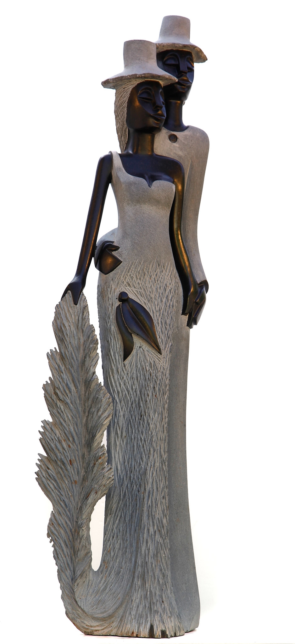 A figurative Shona sculpture of a man and a woman stood with each other.