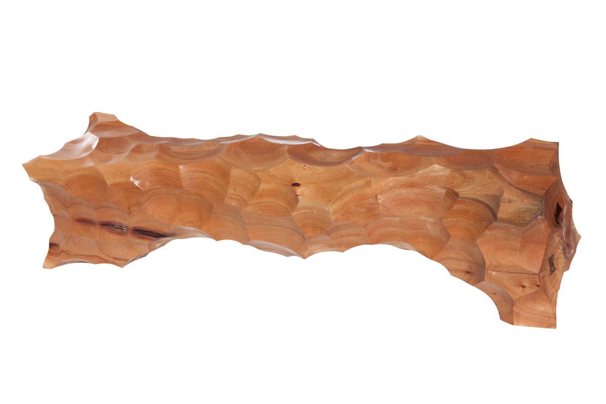 A furniture wooden sculpture of a long cocoon shaped bench.