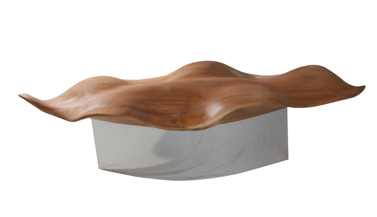 A furniture wood and metal sculpture of a bench in the shape of a crinkly leaf.