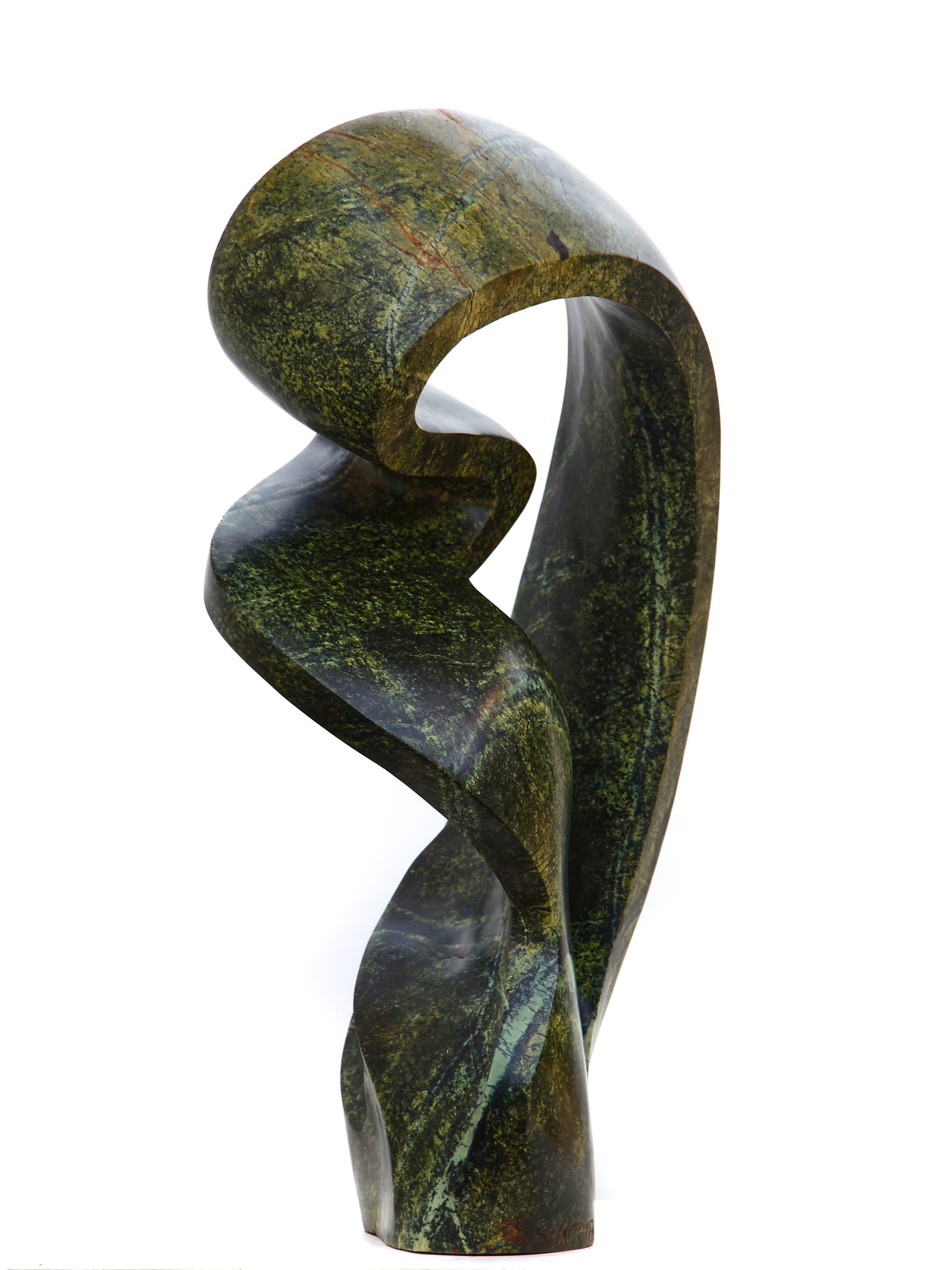 An green abstract shaped Shona sculpture made of Avocado stone.