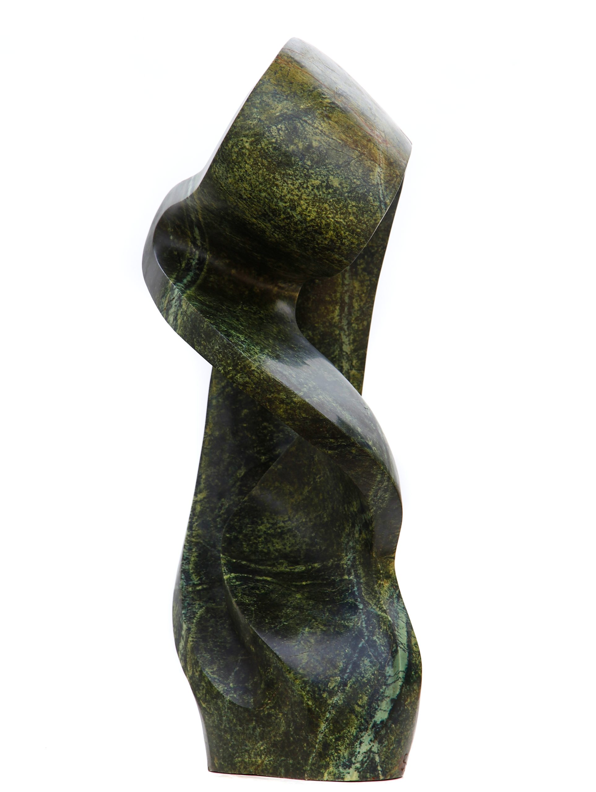 An green abstract shaped Shona sculpture made of Avocado stone.