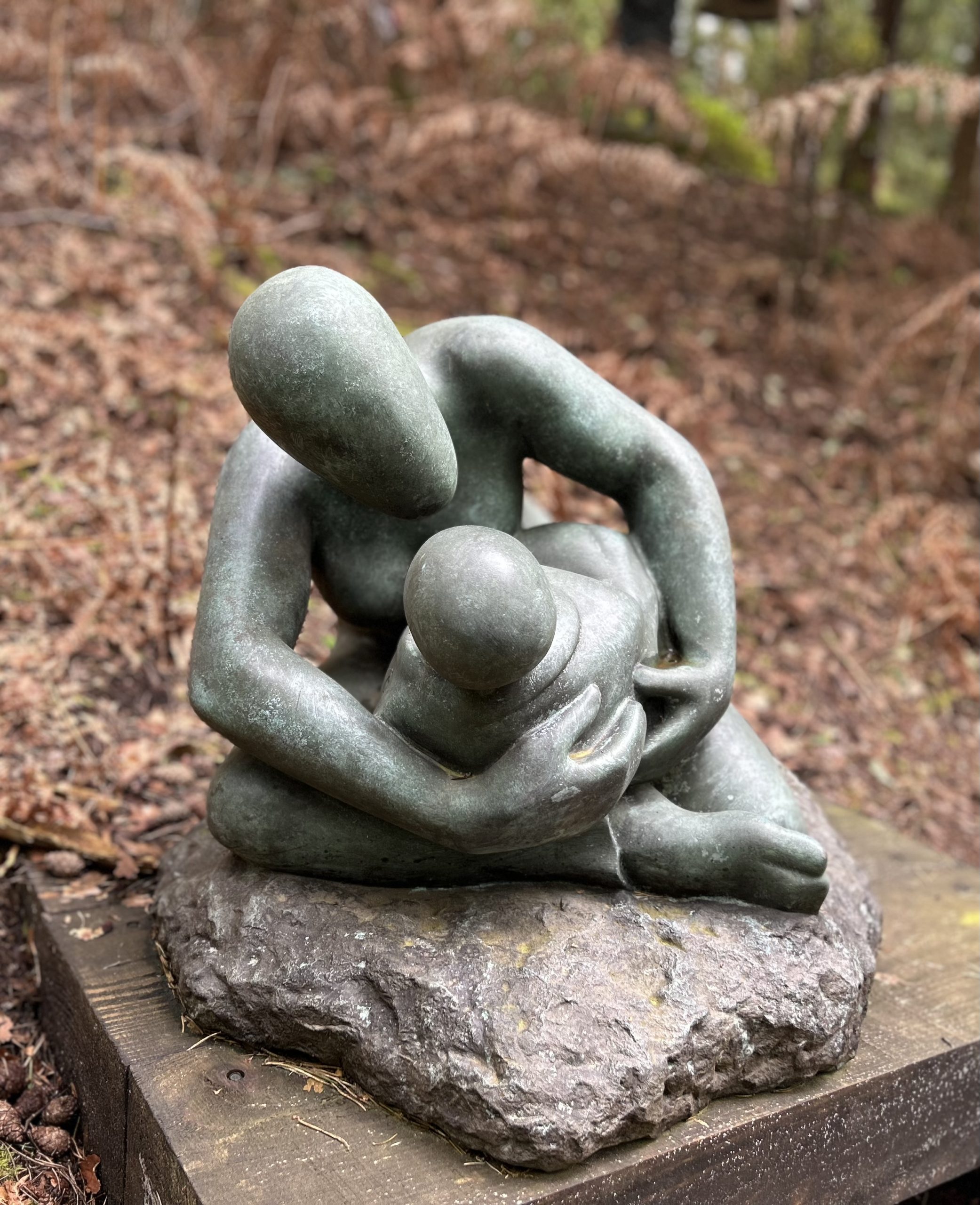 Large Bronze Sculpture of a Mother Cradling her baby and crouching down