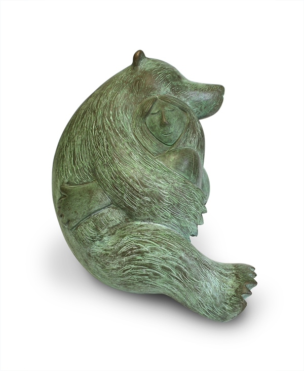 A figurative bronze resin sculpture of a woman and a bear hugging each other.