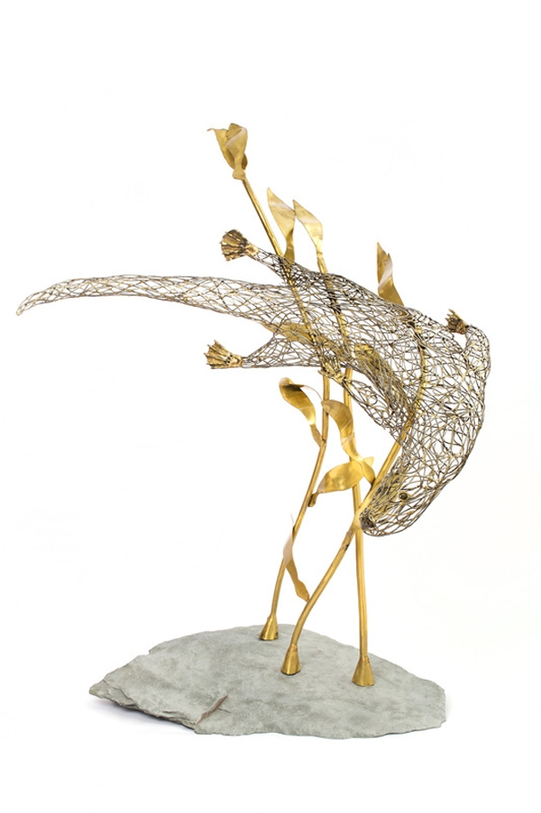 A figurative steel and brass sculpture of an Otter swimming through reeds and water.