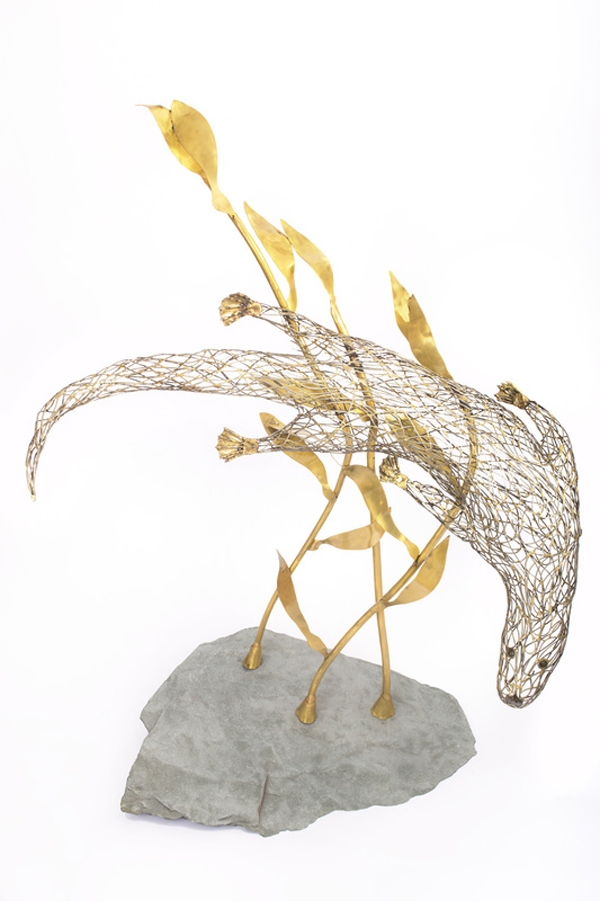 A figurative steel and brass sculpture of an Otter swimming through reeds and water.