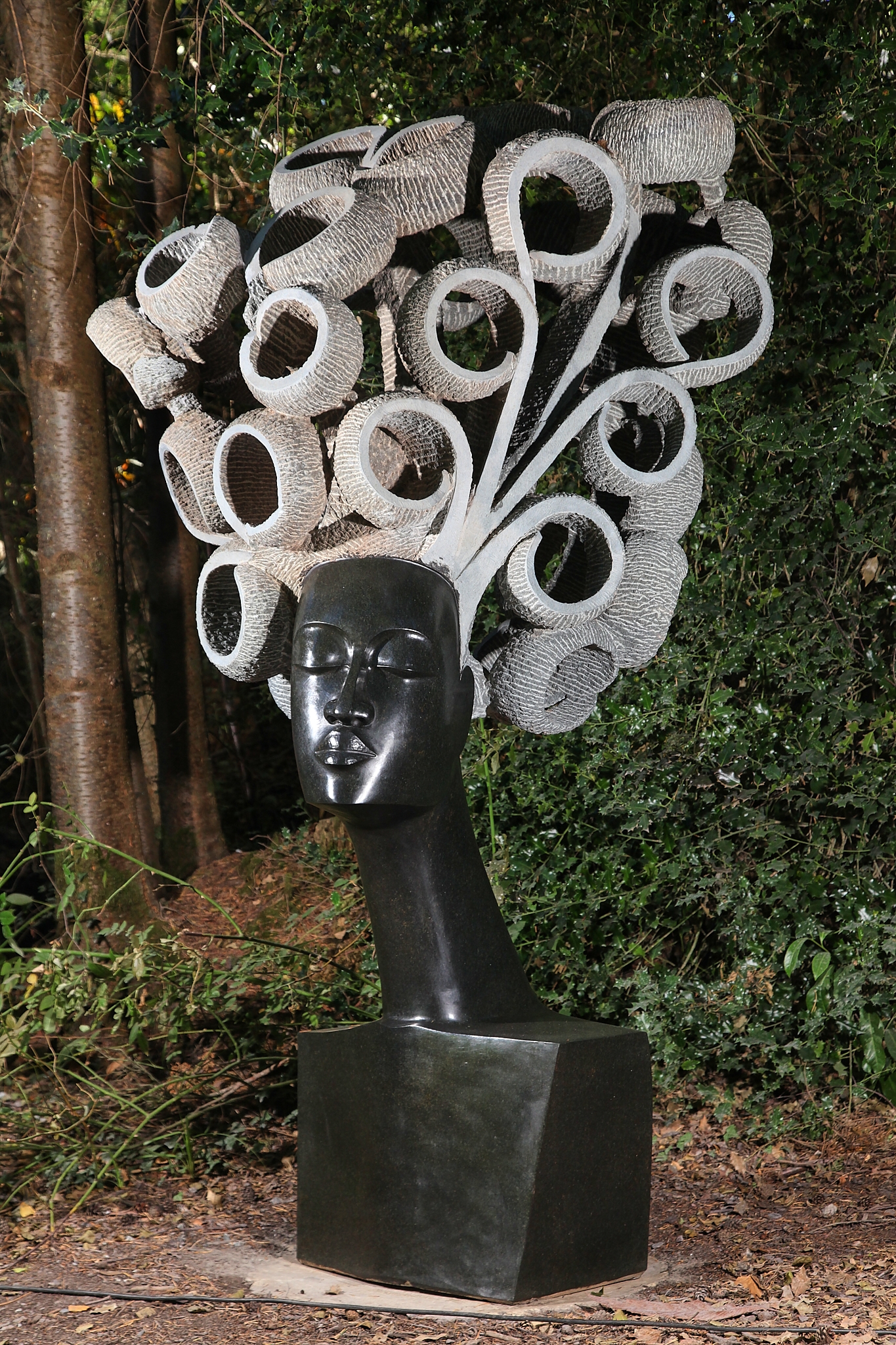 Monumental Zimbabwean Shona Sculpture of a Springstone Head with Big Curly Hair