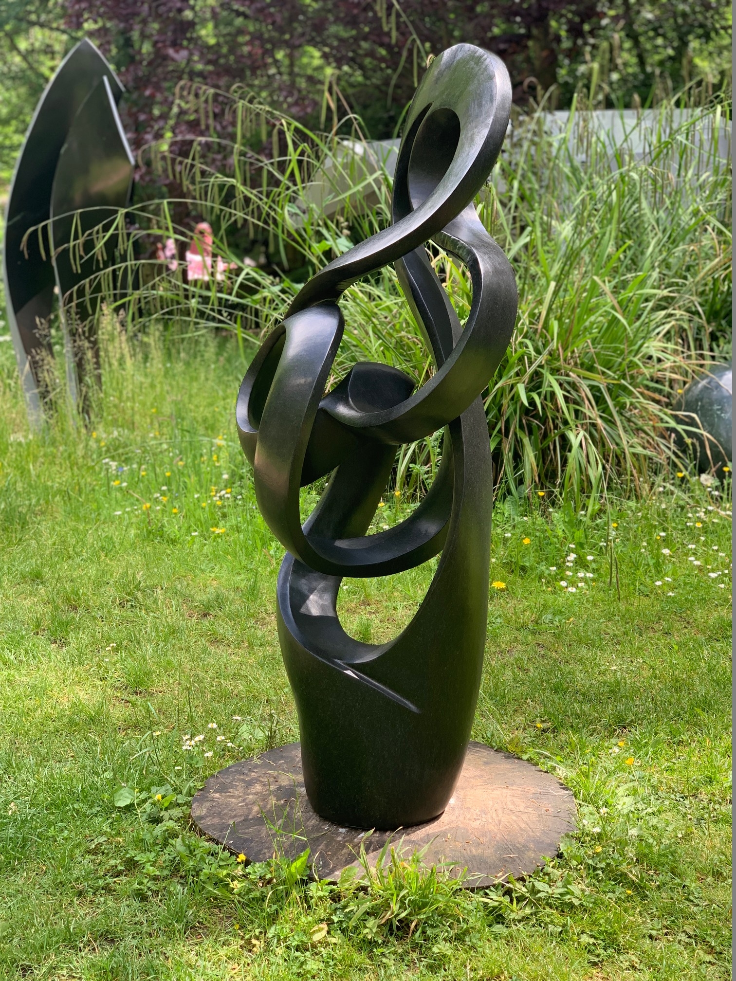 Path of True Love by Sign is an Abstract black stone sculpture of a twisted, spiralling form
