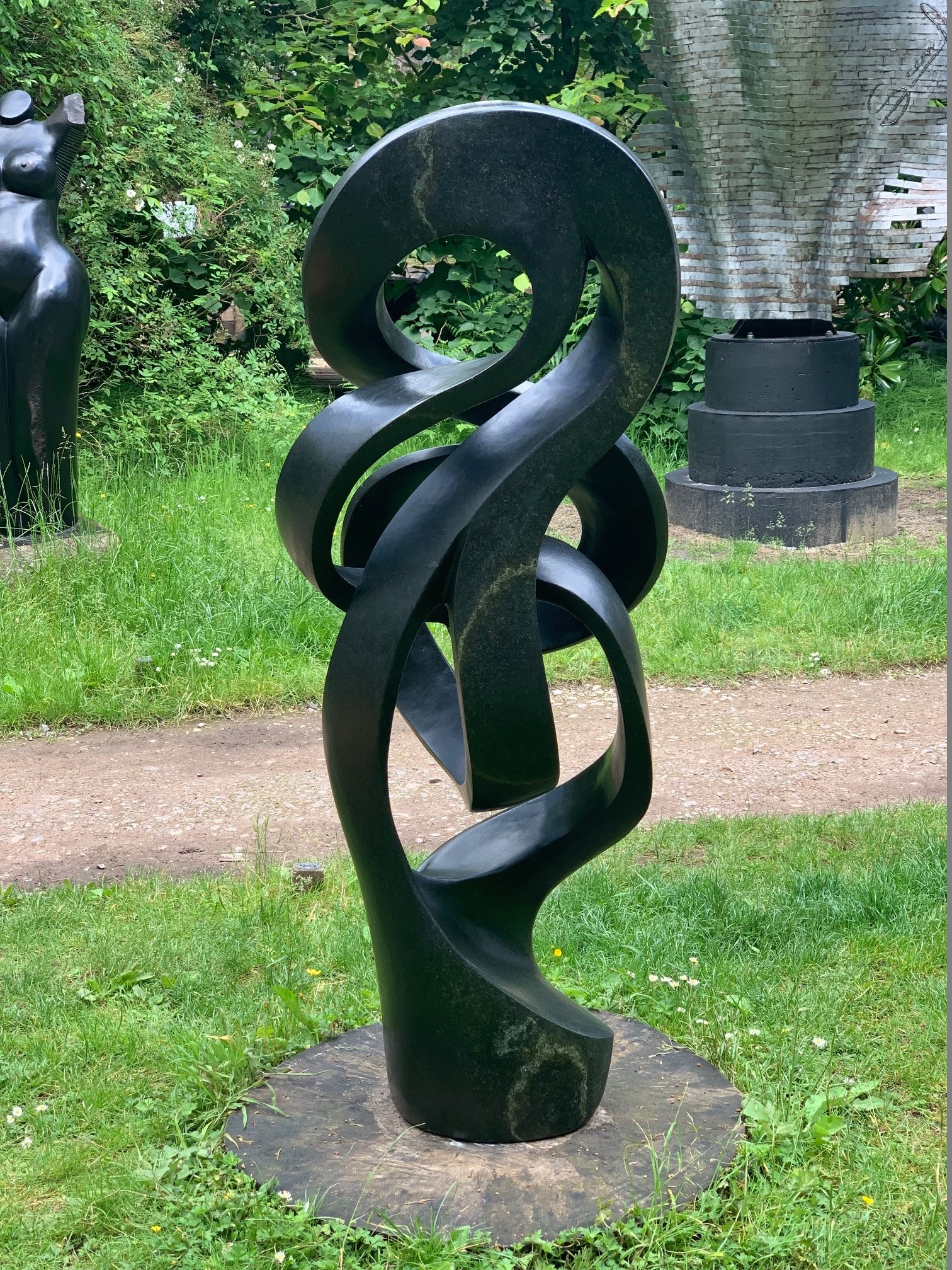 Path of True Love by Sign is an Abstract black stone sculpture of a twisted, spiralling form