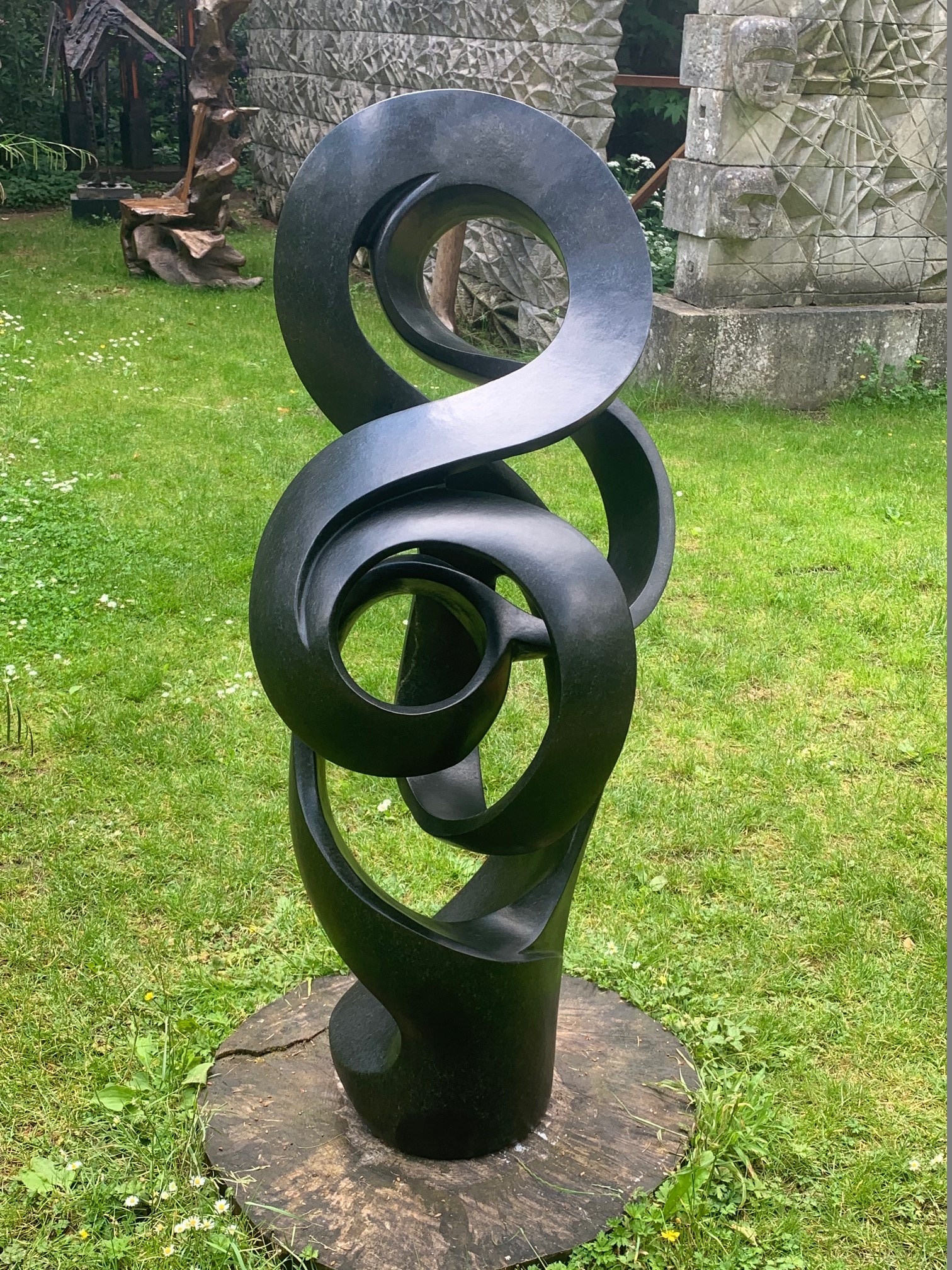 Path of True Love by Sign is an Abstract black stone sculpture of a twisted, spiralling form