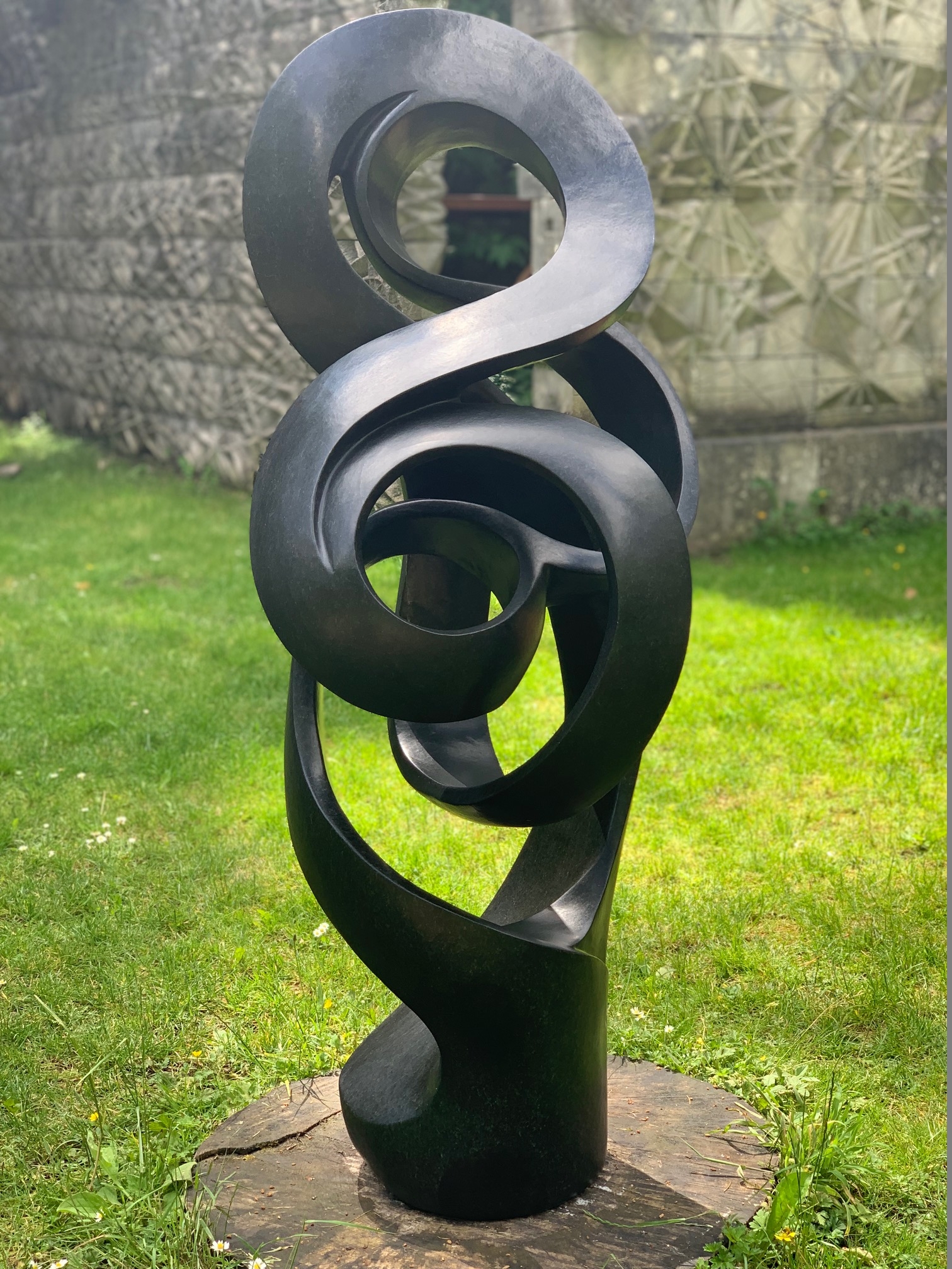 Path of True Love by Sign is an Abstract black stone sculpture of a twisted, spiralling form