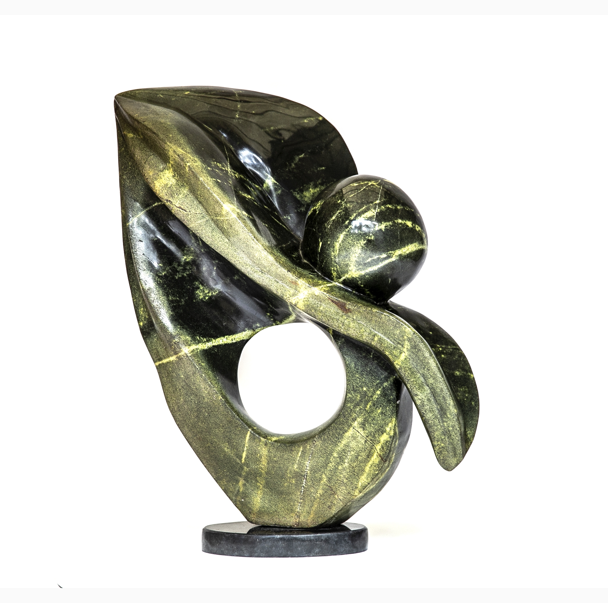 A shona leopard stone sculpture of a floral shape folded over onto itself.