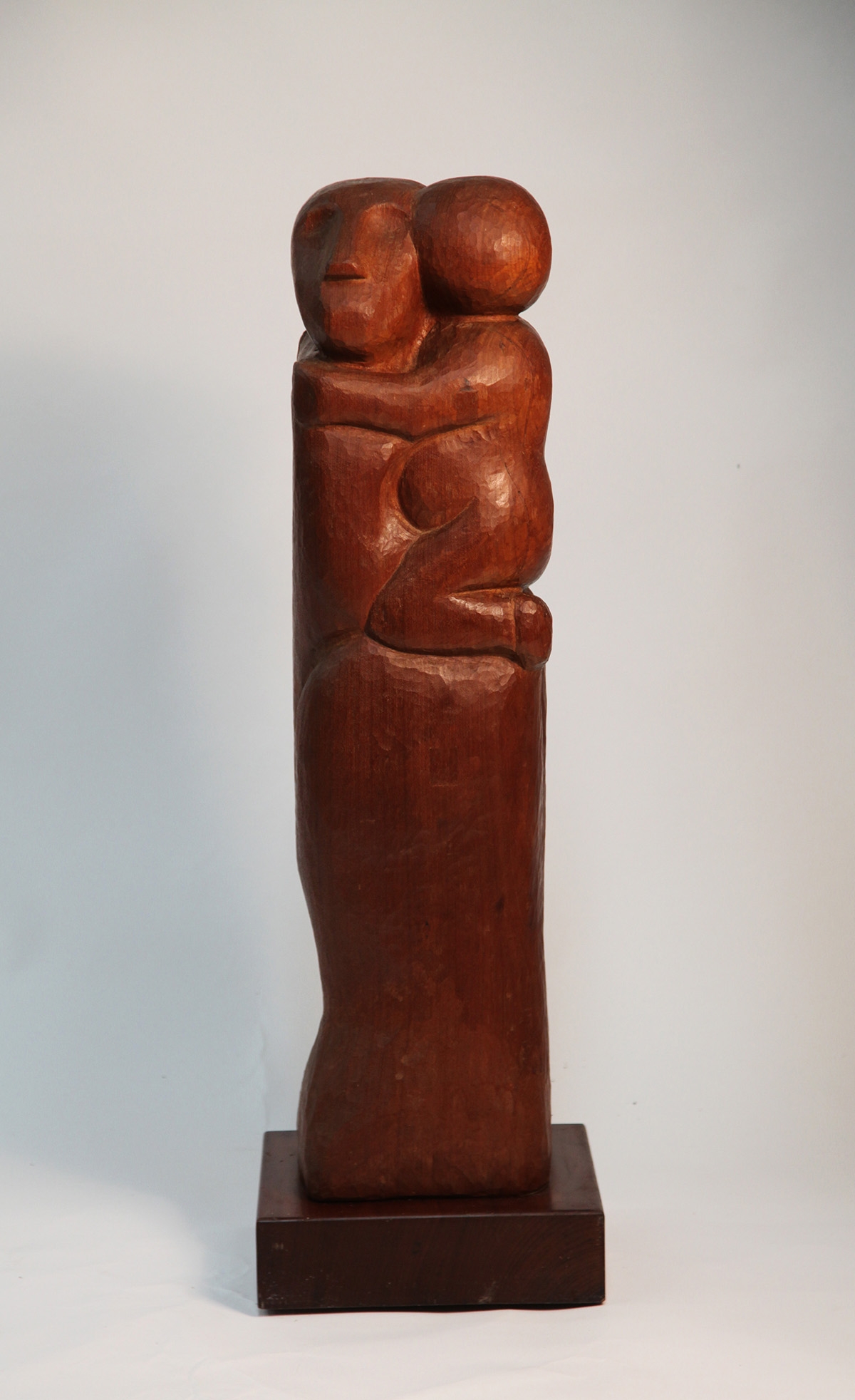 Tall Slim Wooden Carved Rectangular Sculpture of a Mother Holding Her Child
