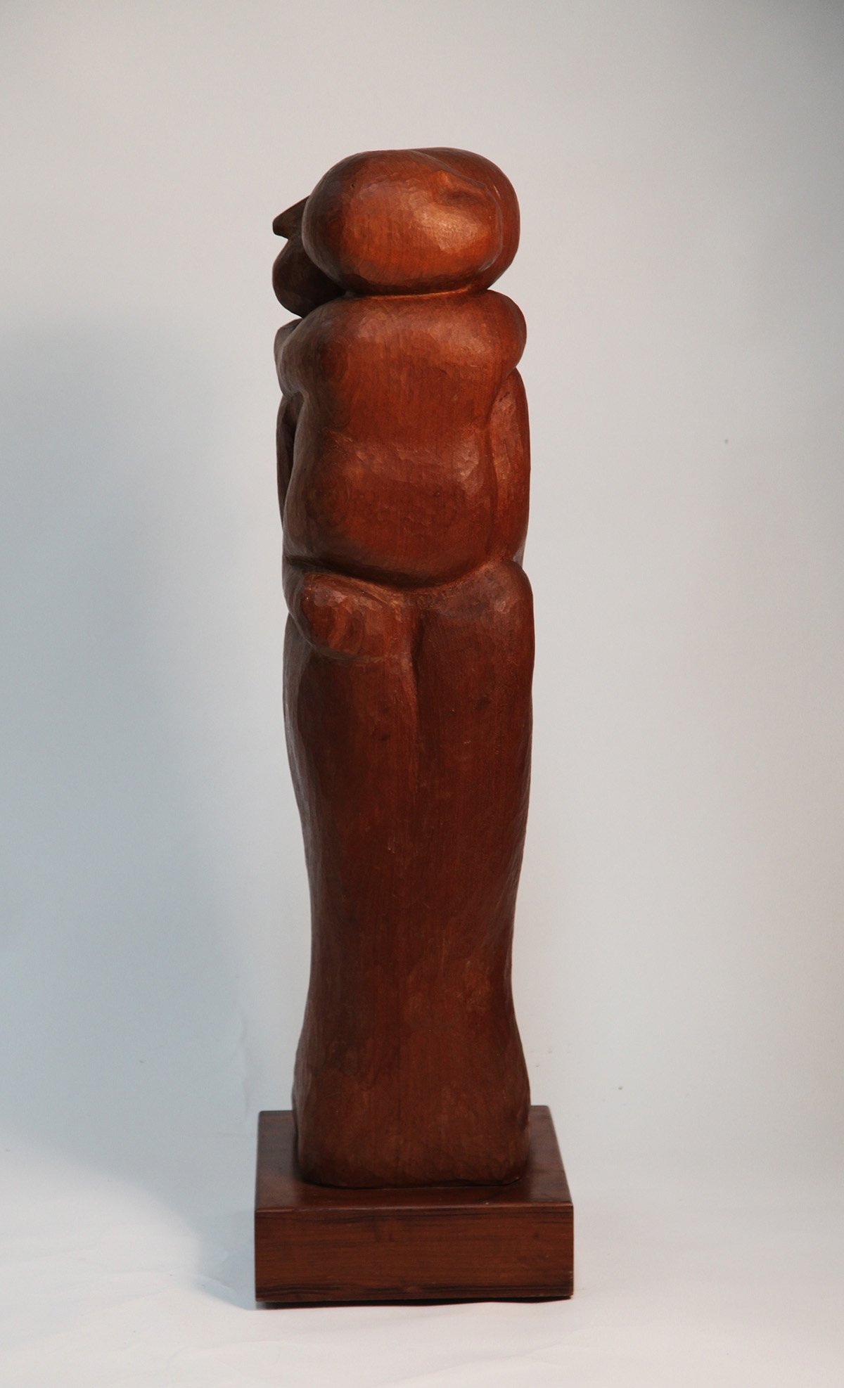 Tall Slim Wooden Carved Rectangular Sculpture of a Mother Holding Her Child
