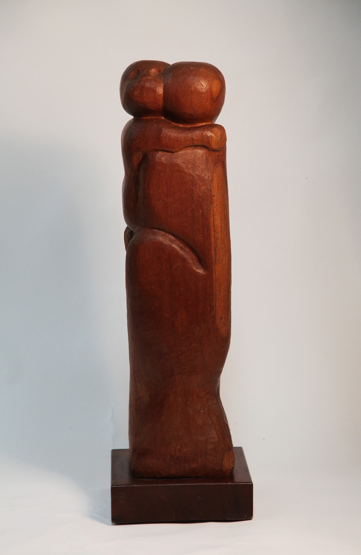 Tall Slim Wooden Carved Rectangular Sculpture of a Mother Holding Her Child