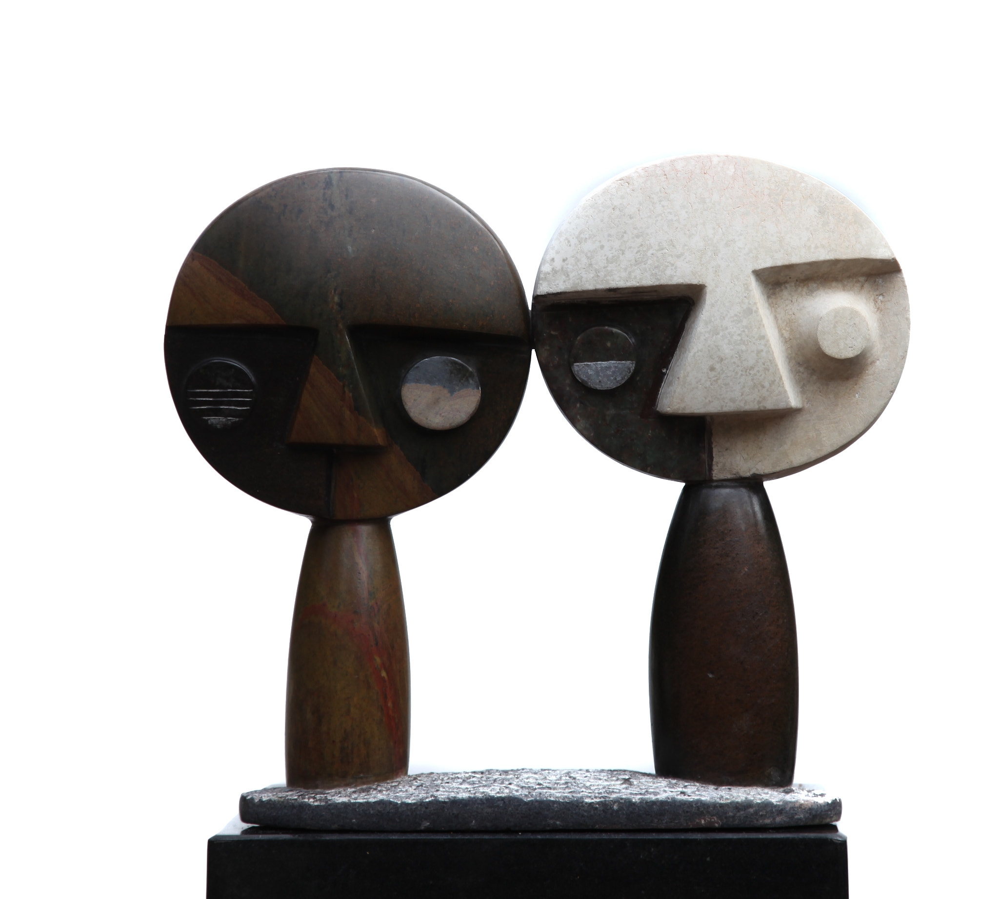 A Shona sculpture showing two abstract figures with large round heads.