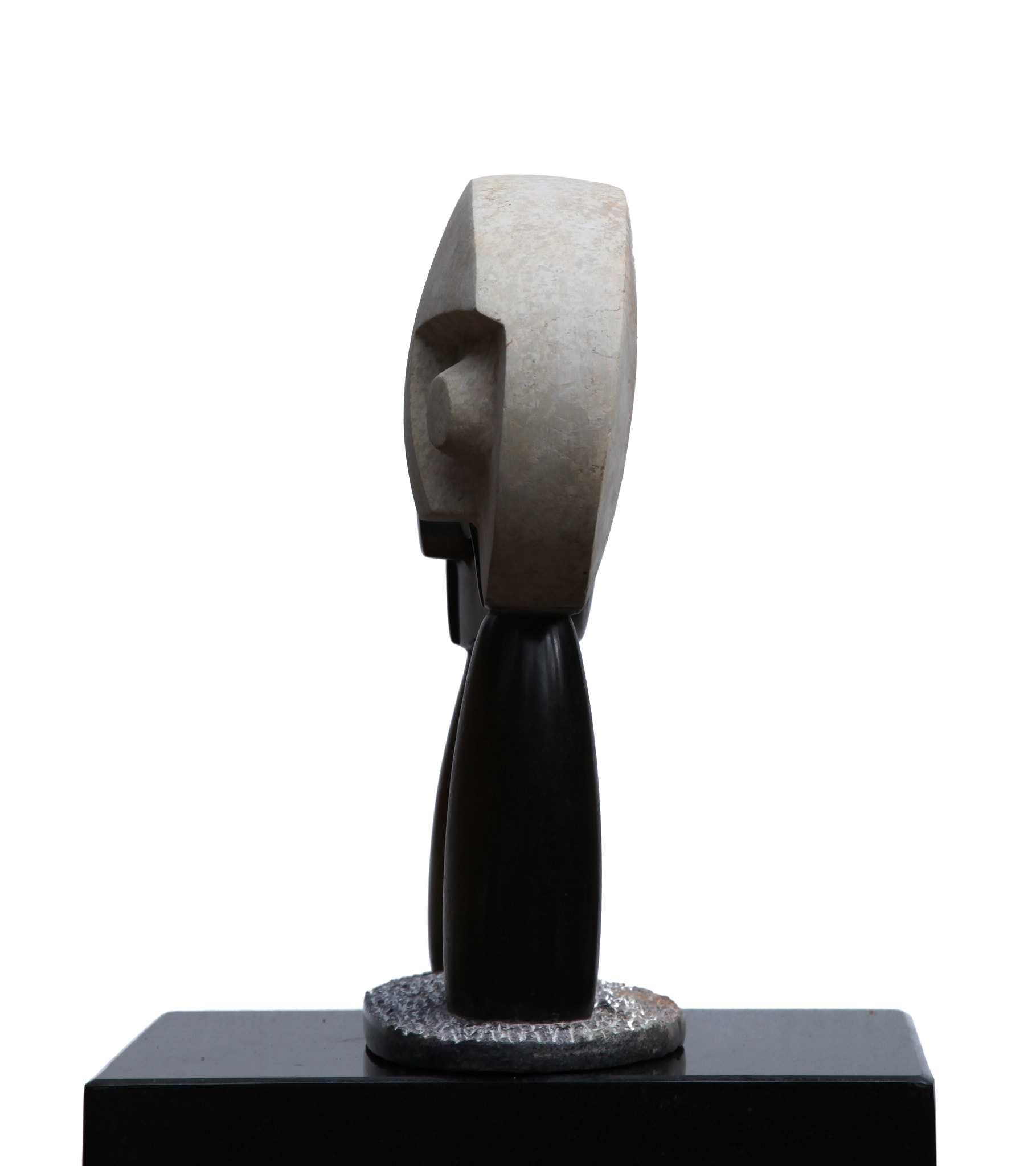 A Shona sculpture showing two abstract figures with large round heads.