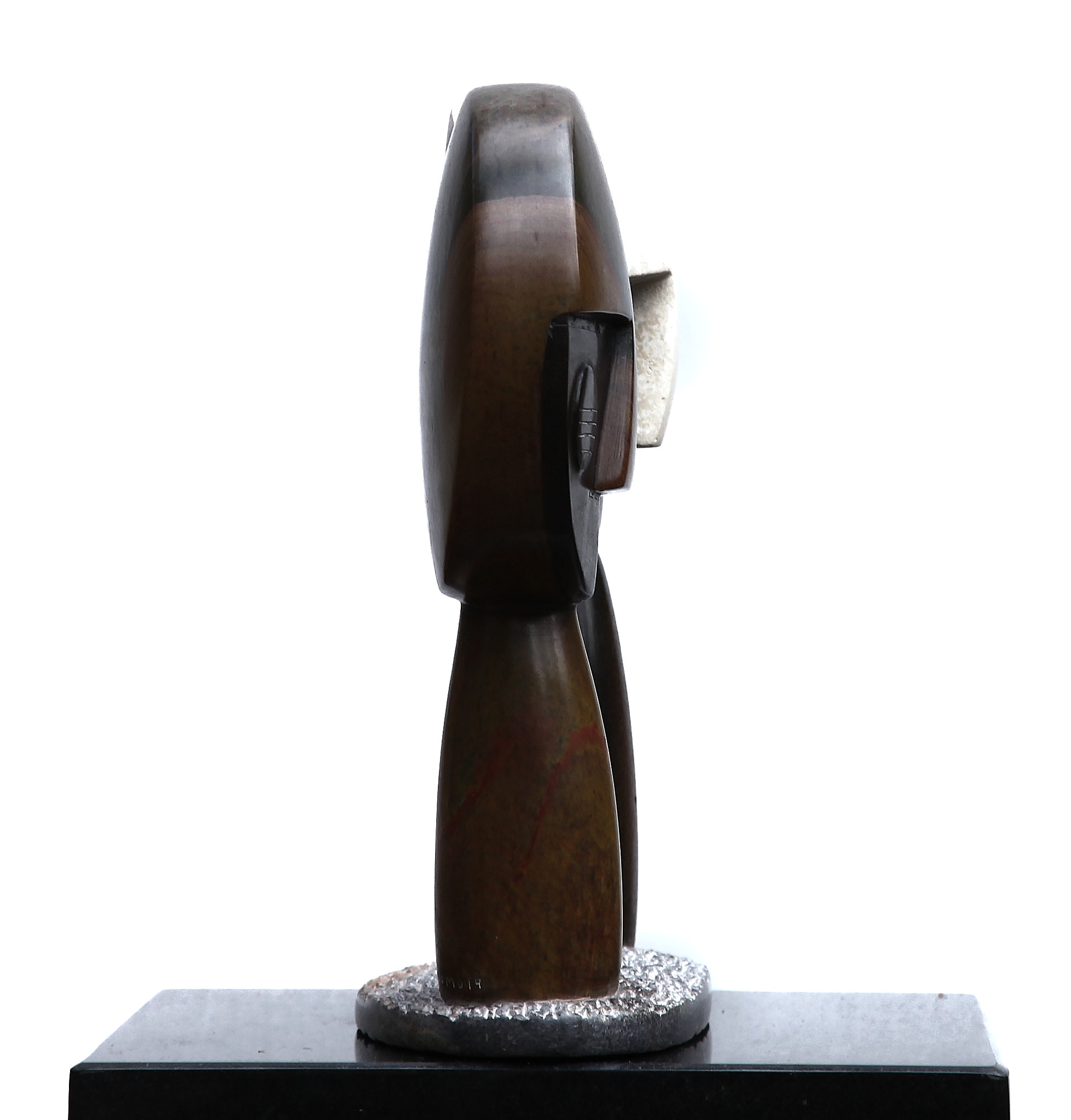 A Shona sculpture showing two abstract figures with large round heads.