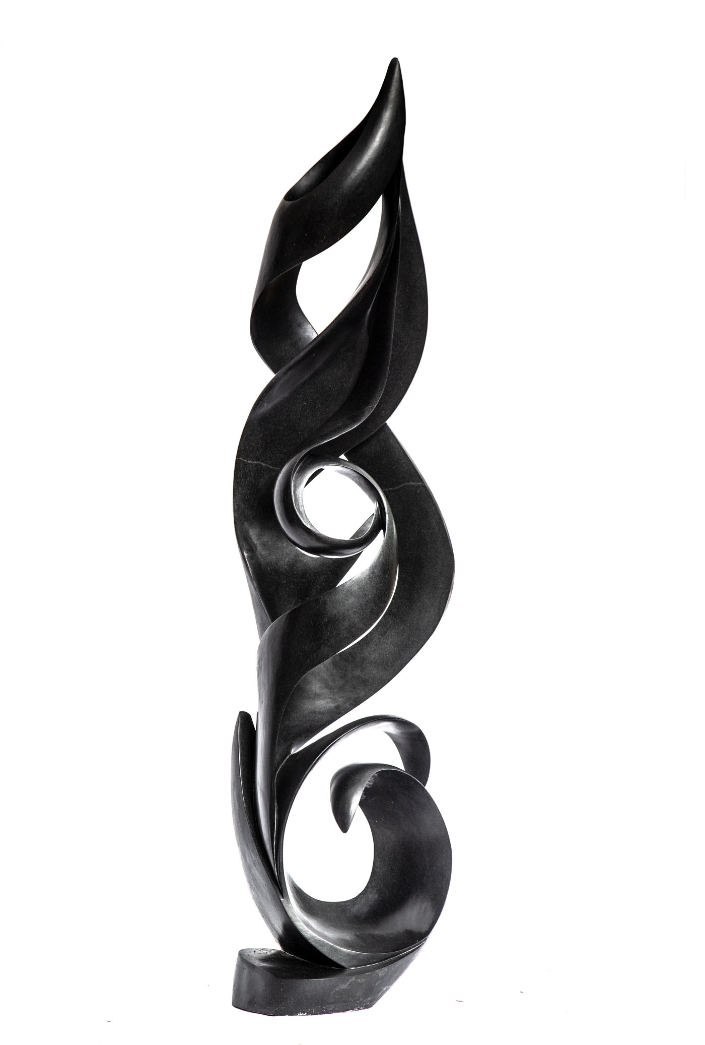 A shona springstone sculpture of an abstract twisting and turning flame.
