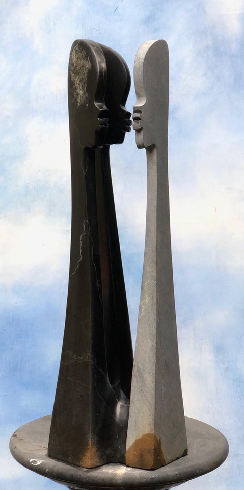 Sisters in Harmony by Tonderai Marezva is a shona springstone sculpture of three abstract female figures