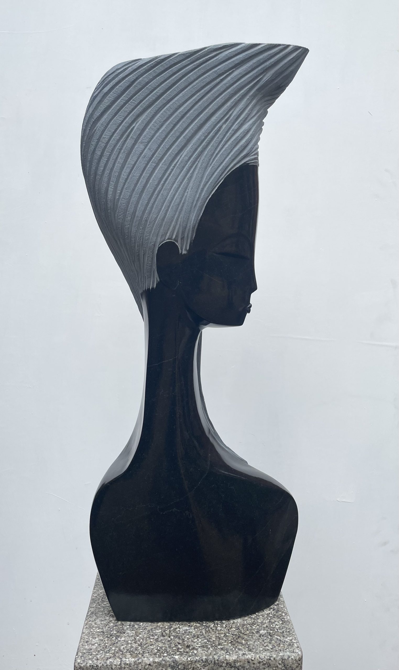 Supermodel by Tutani Mugavazi is a Shona sculpture of a woman's head and shoulders.
