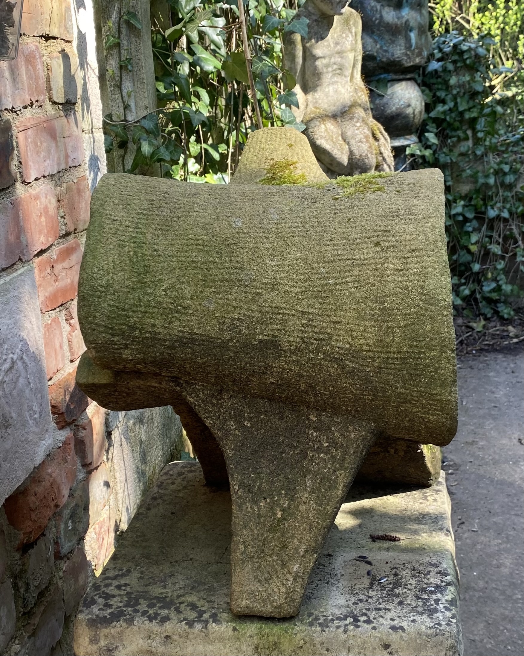 A expressionism stone sculpture of a piece of bone vertebrae.