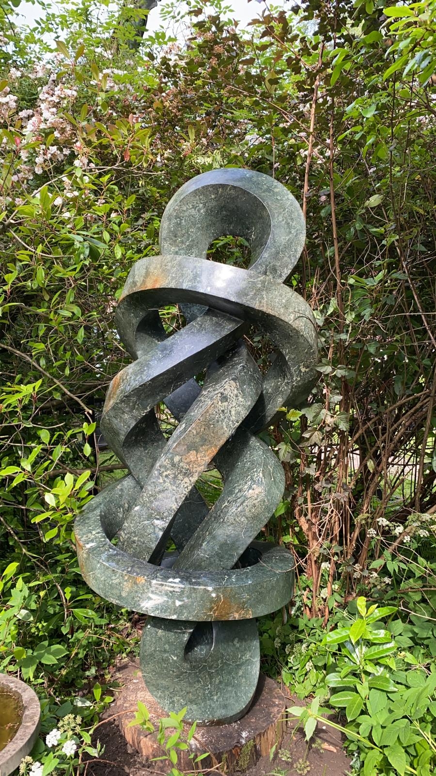 A abstract Shona sculpture made from opal stone that twists around in various ways.