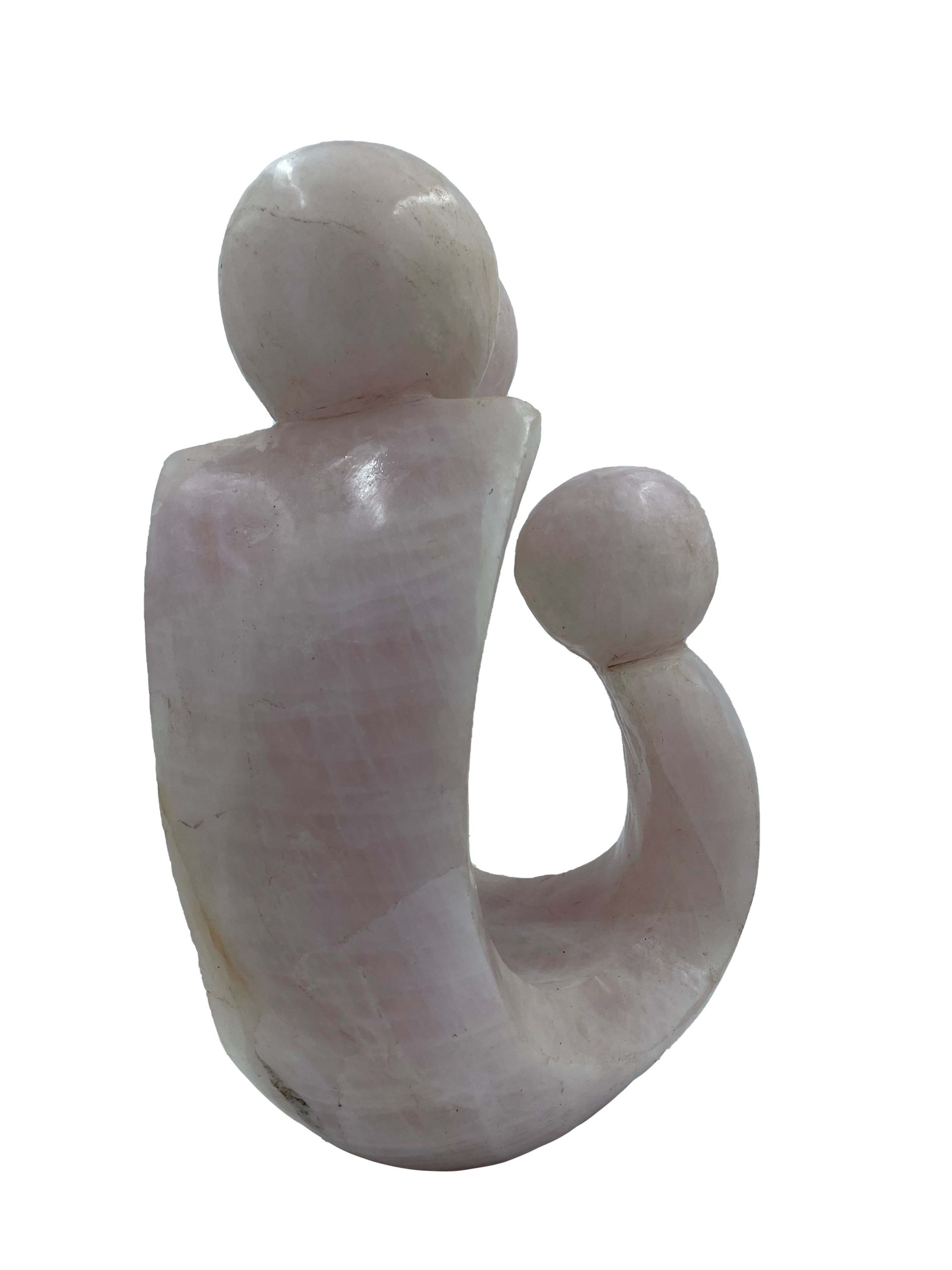 Abstract and Simplistic Shona Stone Sculpture of a Family of Three in A light pink stone